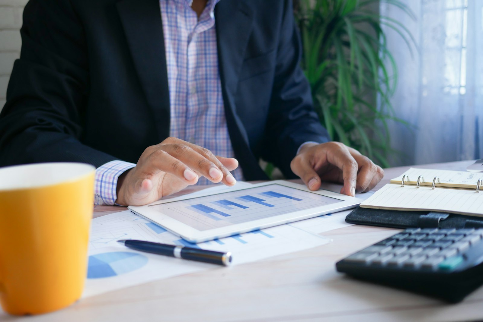 Advisor reviewing financial charts on a tablet